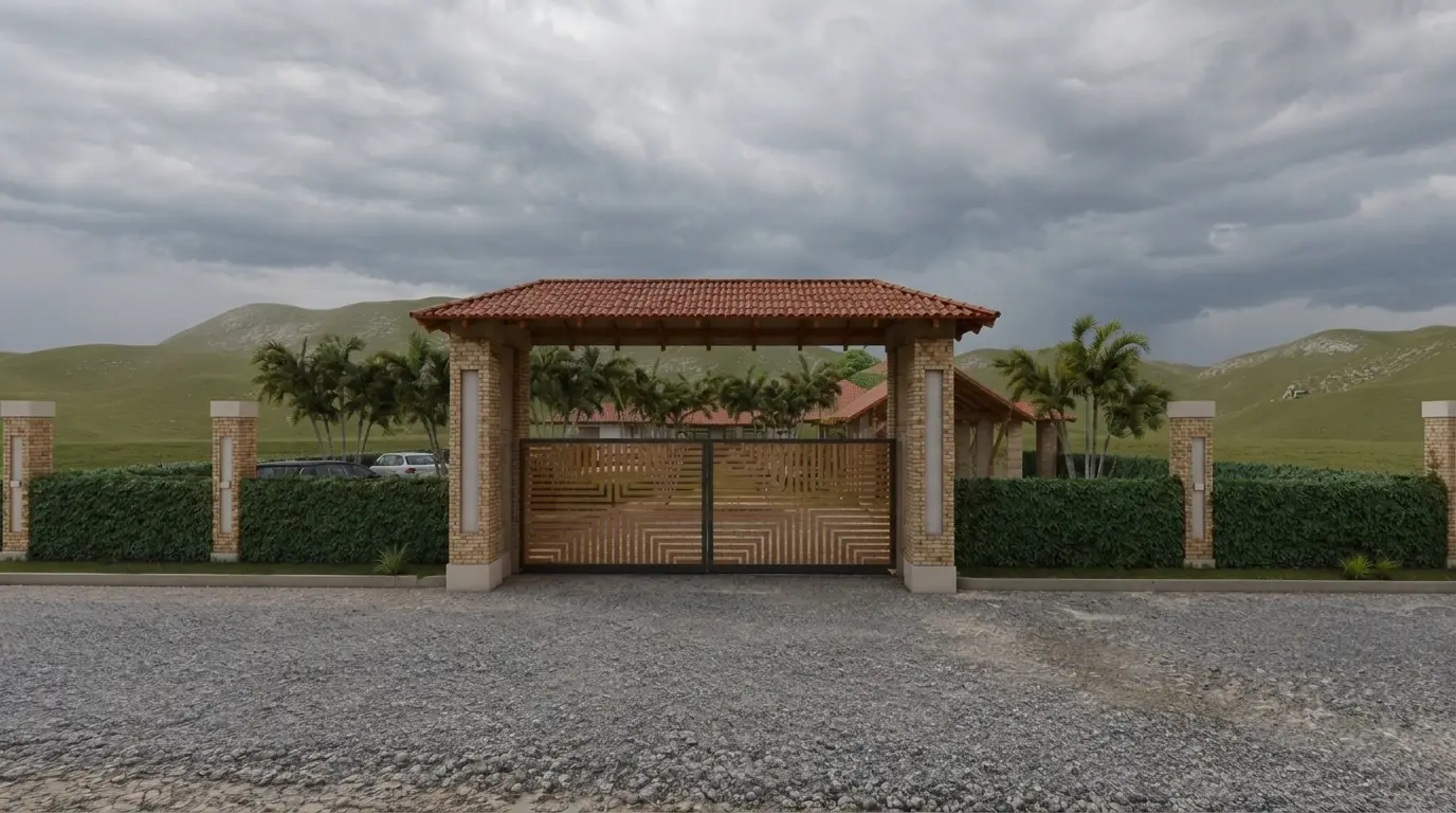 Portal de acceso de Villa Roma de día, con cerramiento vegetal